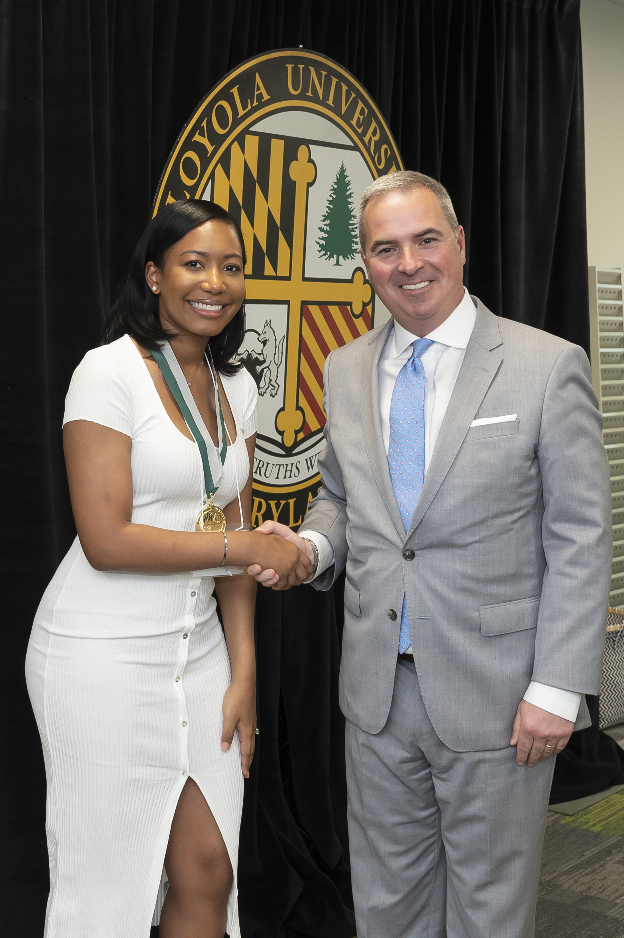 President Sawyer and awardee Emerging Scholars Celebration of Research, Loyola Univ. Maryland