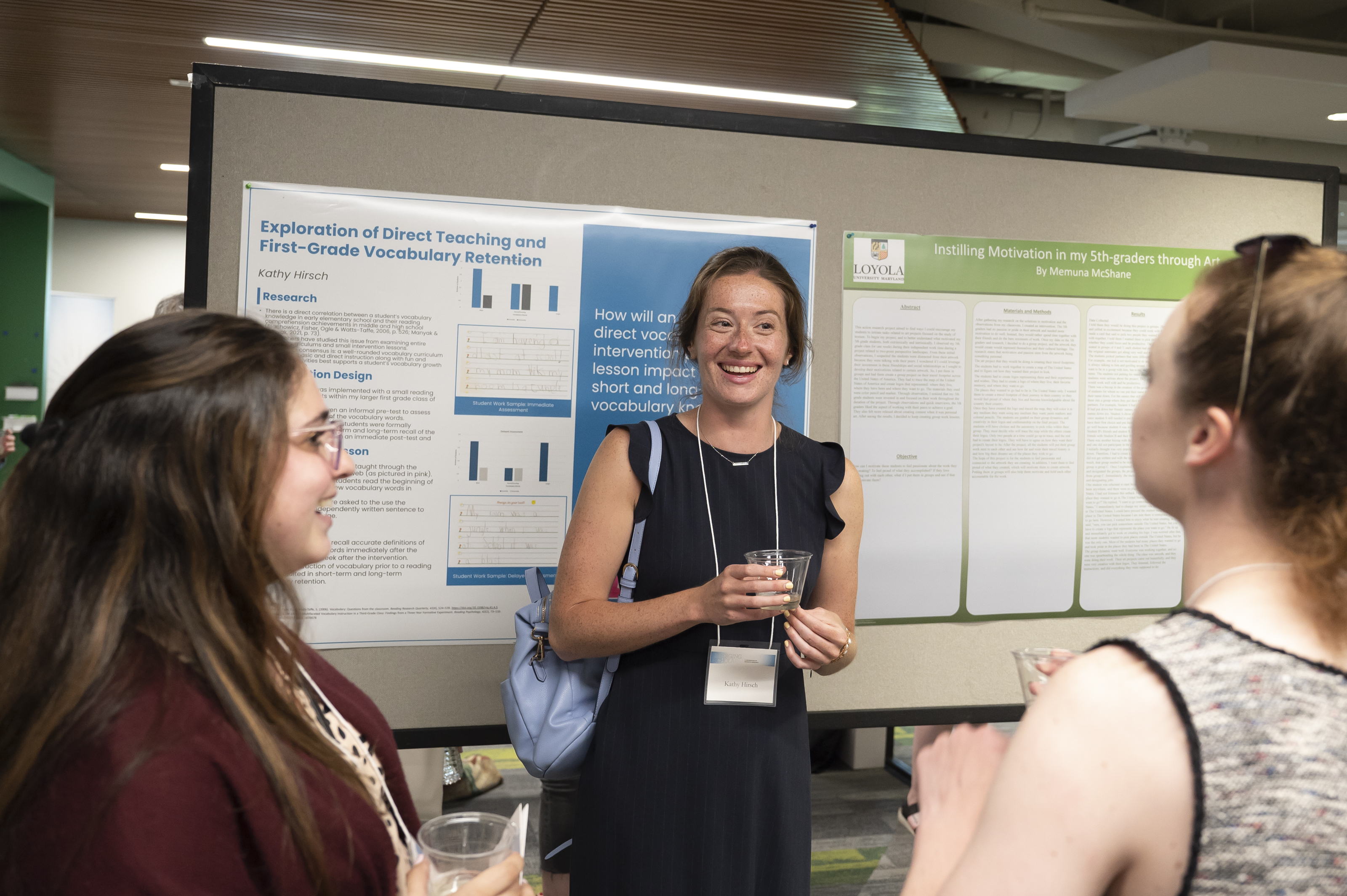 Presenter smiles as she takes a question about her poster