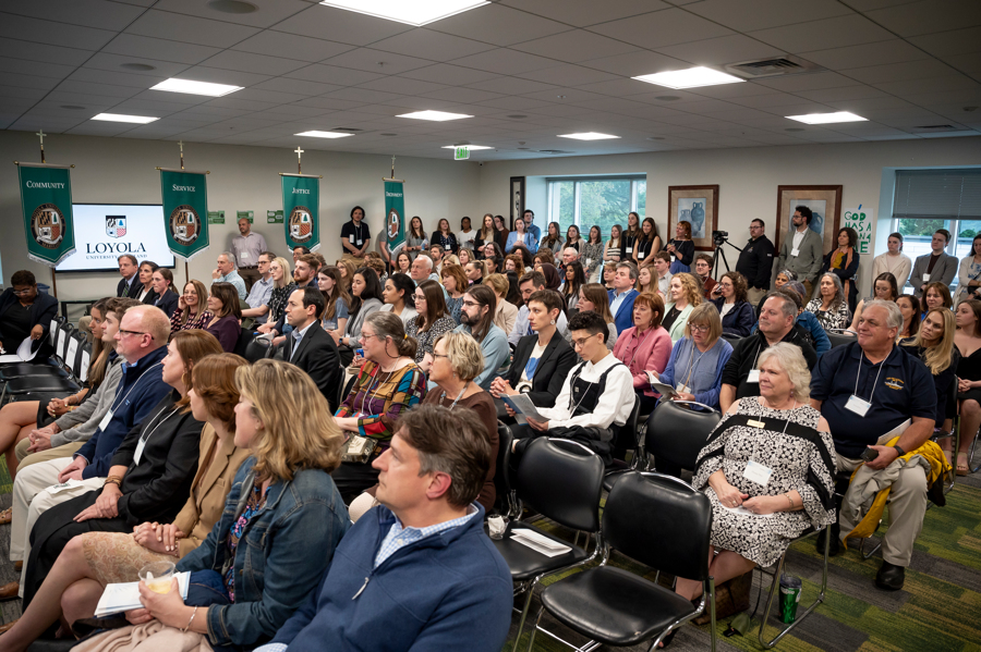 A crowd gathers, seated for the Emerging Scholars awards ceremony