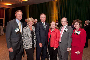 Ken, ’76, trustee, and Kathy Boehl, parents ’11, Ed, ’74, trustee, and Ellen Hanway, parents ’99, and Mark, former trustee, and Ann Baiada, parents ’02, enjoy the pre-lecture reception