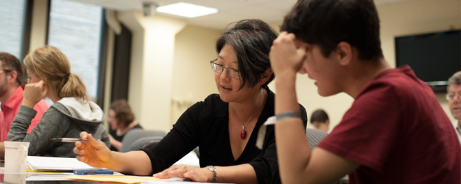 Faculty working with students