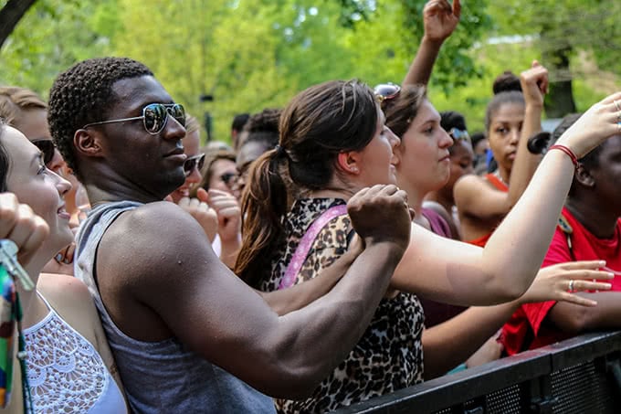 Student raising arm and dancing at Loyolapalooza