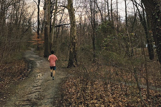 A student jogs along the Strony Run Trail.