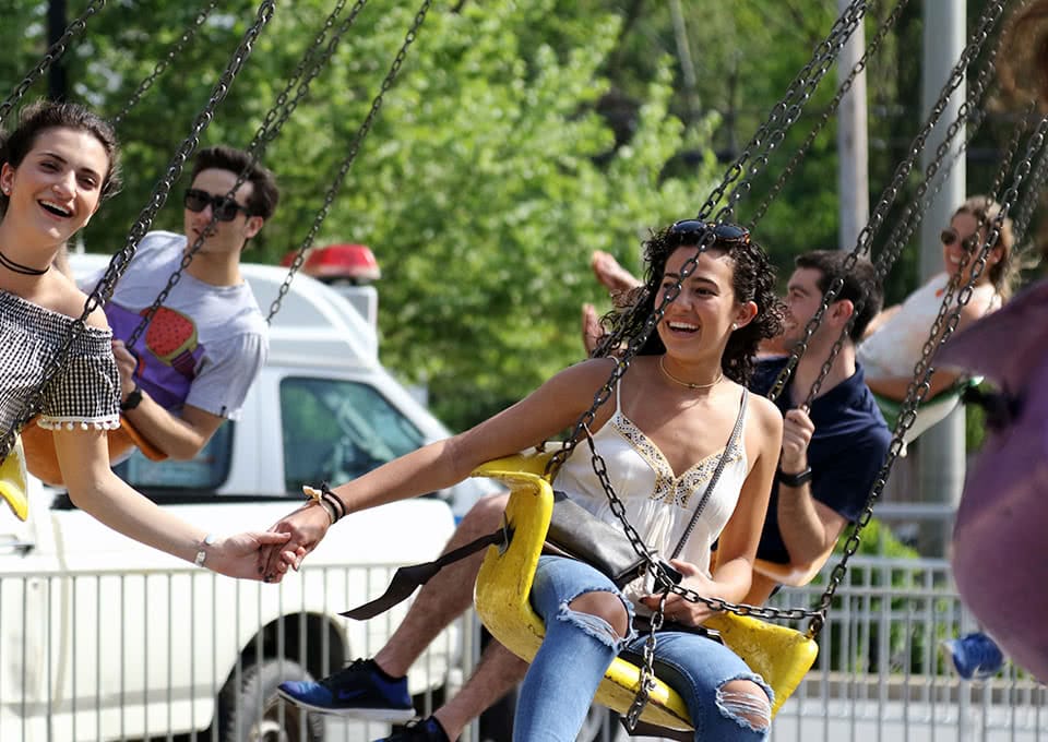 Students on a spinning swing ride