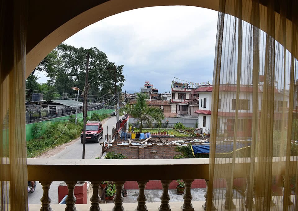 Looking out a window, with houses in the background