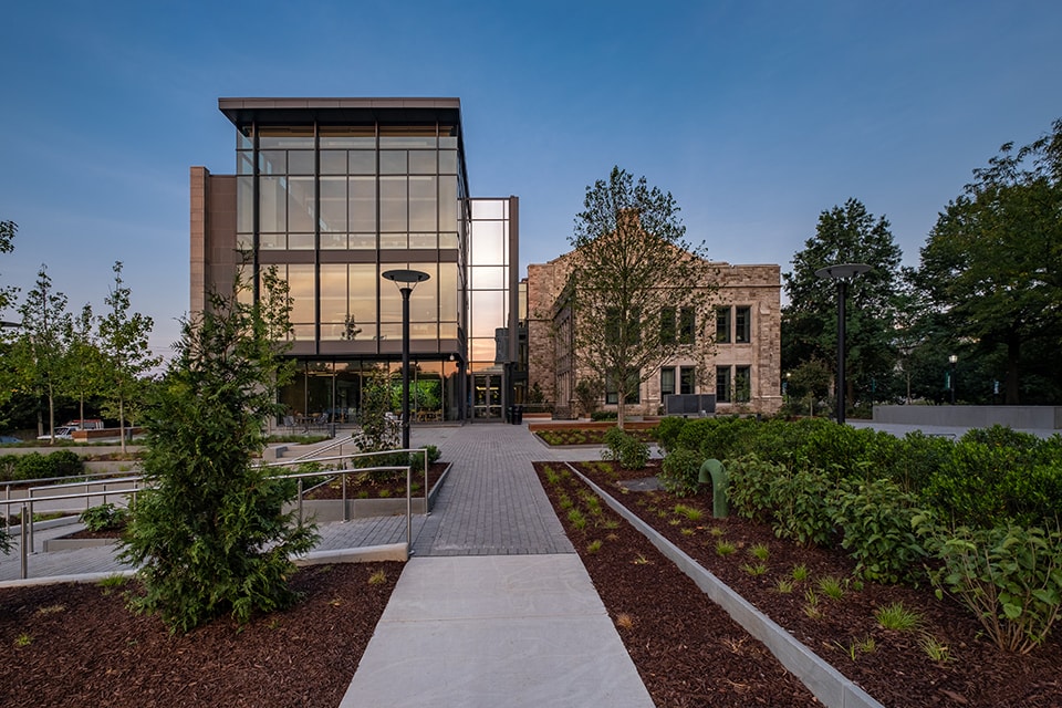 Exterior of the Fernandez Center with various bushes and trees out front