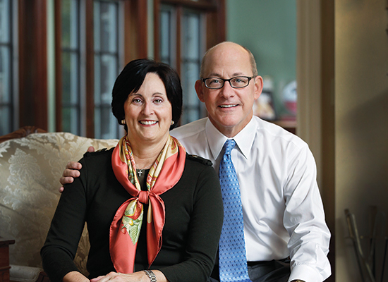 Tony and Elaine Grillo sitting in their home.