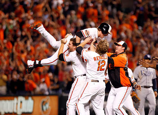 Orioles hold up fellow teammate in celebration