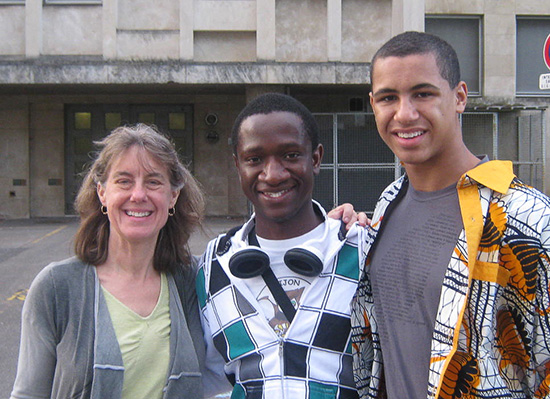 Elizabeth in photo with two students.