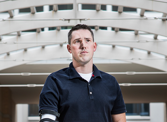 Portrait of Captain Greg Galeazzi beneath outdoor archways.