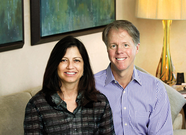 David and Kathy sitting in their home.