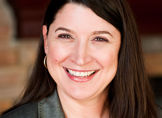 Elizabeth Dodson smiles in professional portrait.