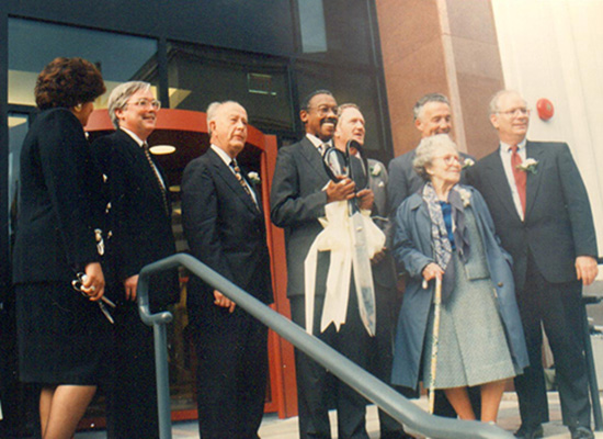 Charles Dorsey cuts ribbon.