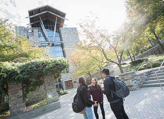 Students talking outside the Selling School of Business.