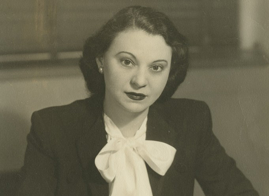 Antique photo of Bessie in professional clothing.