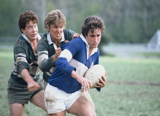 Geoff Failla, ’80, and Greg Fudge, ’80, prepare to tackle a Mount Saint Mary’s player.