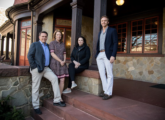 Ingersoll family posing at the humanities manor patio.