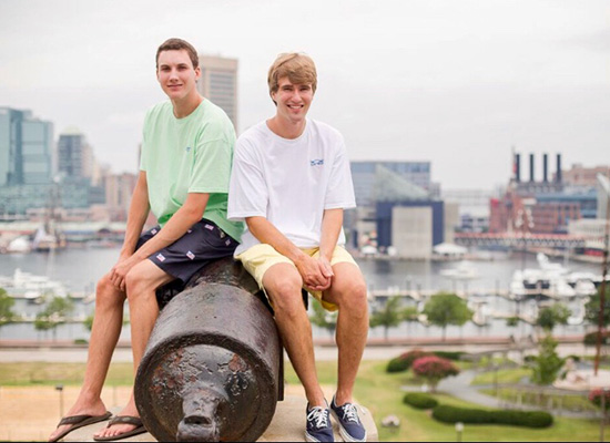 Wilmer and Ames sitting on an old cannon at Federal Hill, overlooking Baltimore.