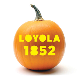 Pumpkin with Loyola 1852 carved in it