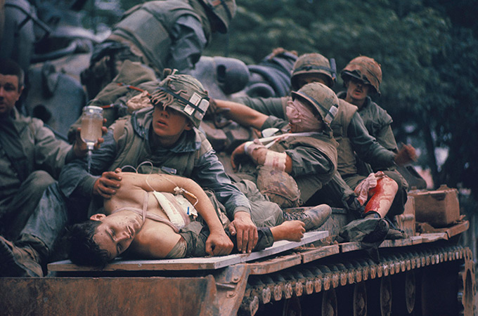 Injured soldiers transported on a tank in Vietnam