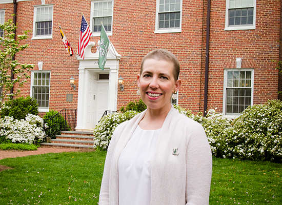 Photo of Riopko outside her beautiful brick home.