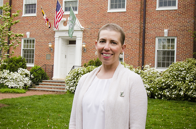 Riopko stands outside her home.