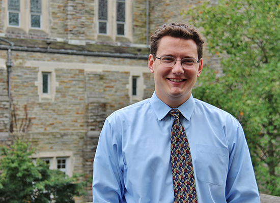 JP in dress shirt and tie outside the alumni chapel.