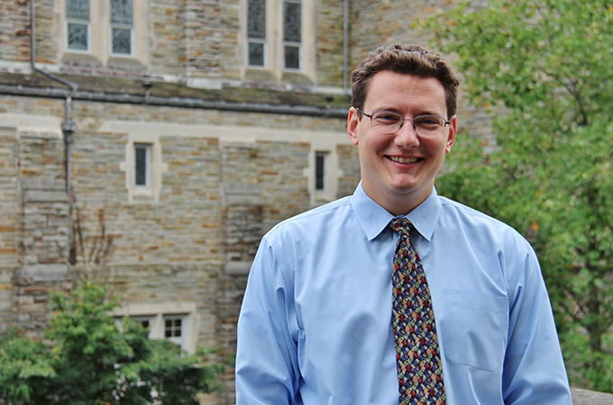 Krahel standing outside the alumni chapel.