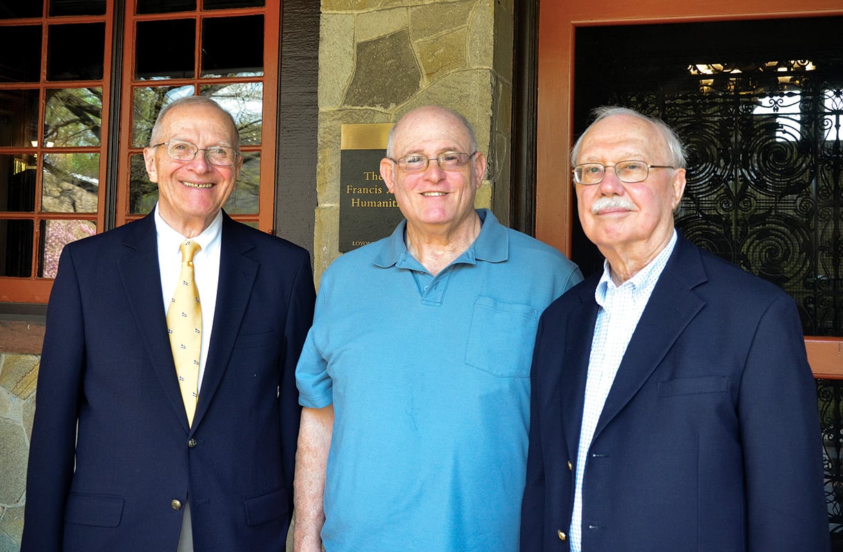 Laurence, Thomas, and Michael in group photo at the humanities manor porch.