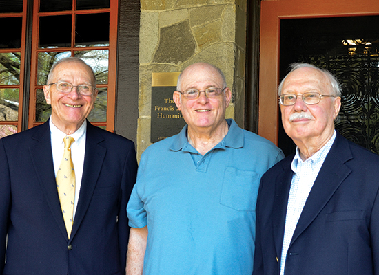 Laurence, Thomas, and Michael in group photo at the humanities manor porch.