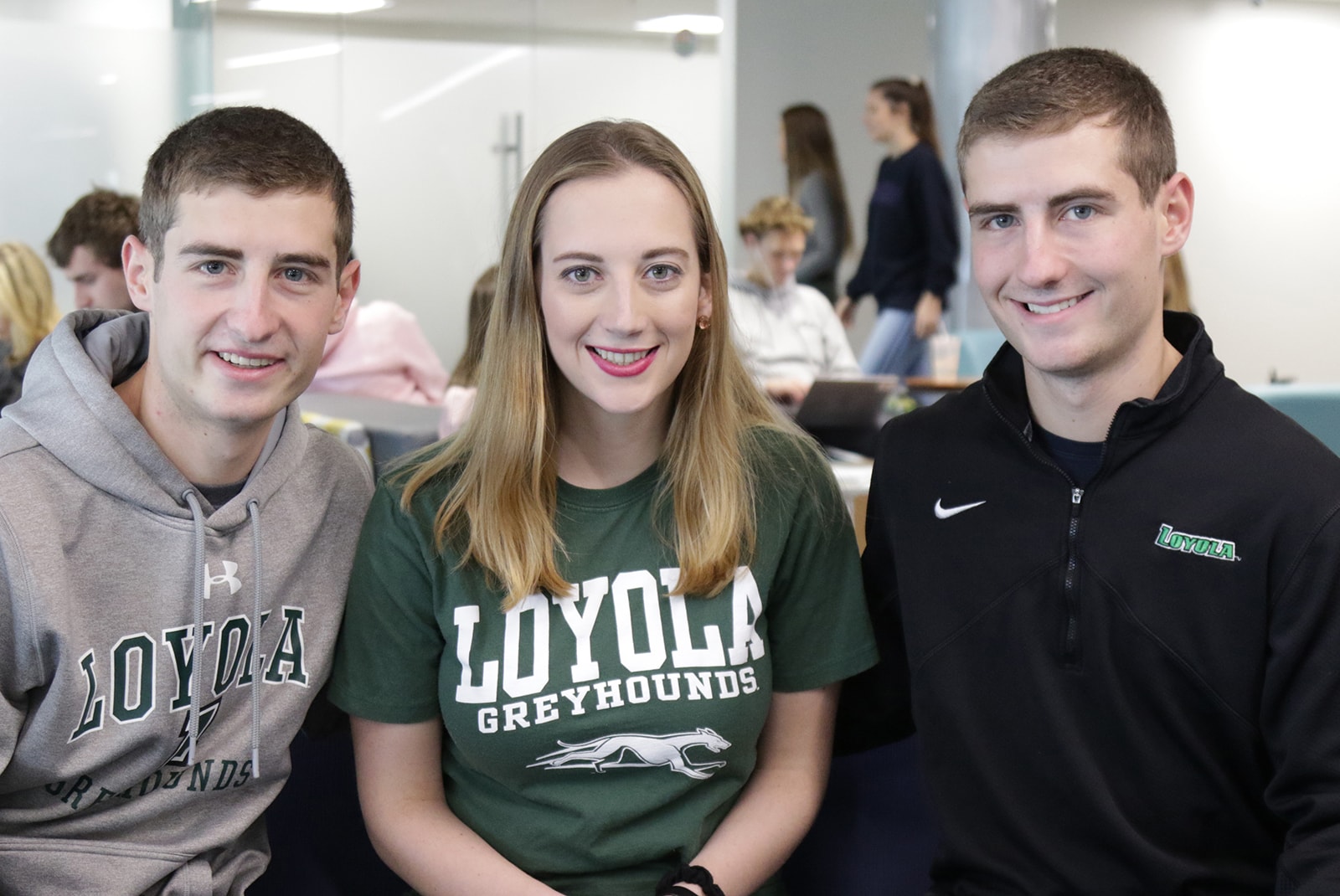 The three Hughes triplets posing for a photograph