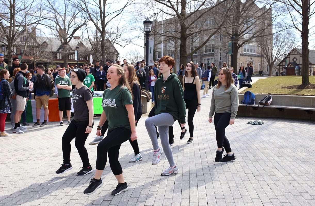 Group of students practicing a dance for Loyola's Irish step dance team