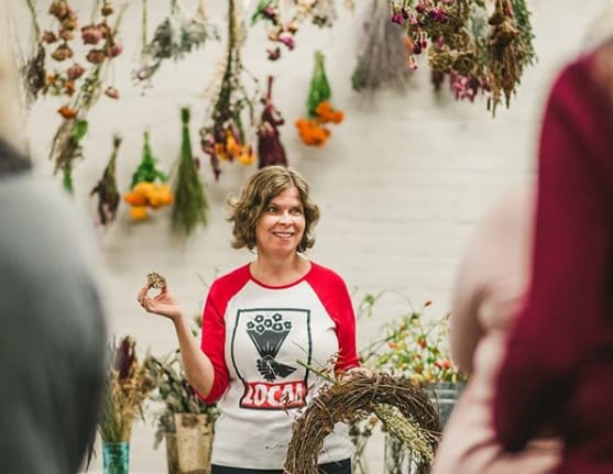 Ellen Frost teaching a class on floral design