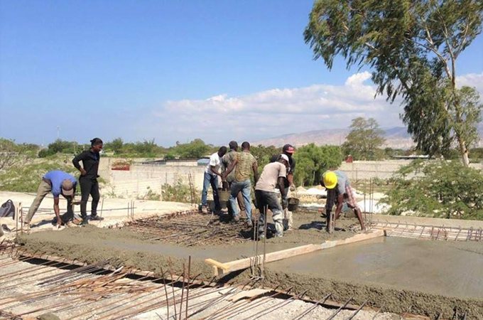 Builders working on the transition house.