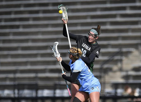 Taylor Vanhof tries to keep the ball as she runs