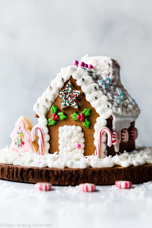 Gingerbread house decorated with various candies and icing