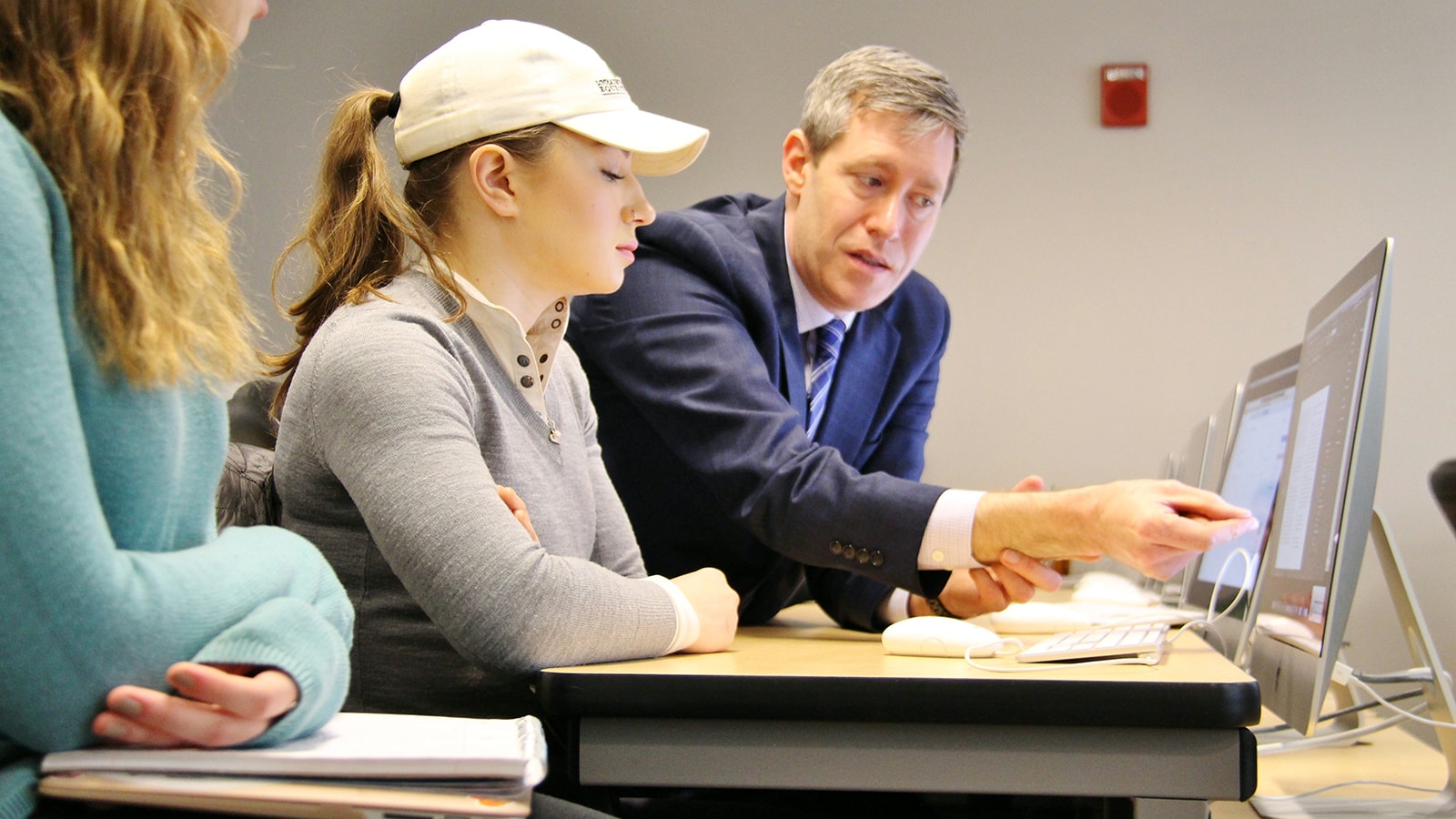 Professor Kevin Atticks instructing students on how to use book layout software