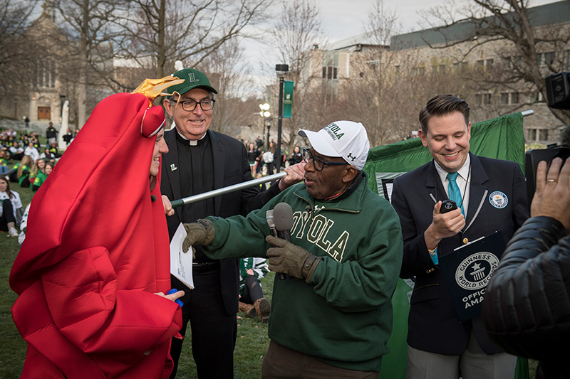 Al Roker interviewing a student wearing a crab suit