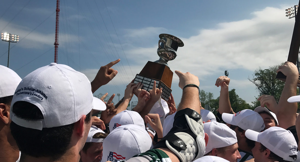 Loyola Men's Lacrosse team holding a trophy