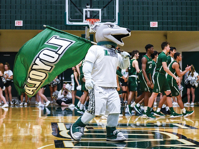 Current iteration of Iggy in 2023 waving a flag at a mens basketball game