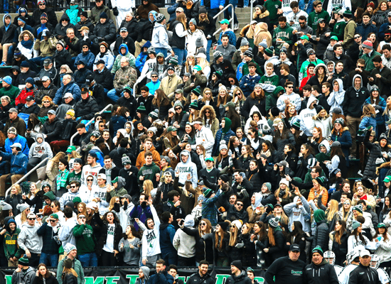 A crowd of Loyola students at a Lacrosse game