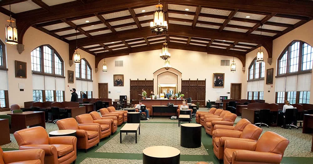 The Study, with red leather chairs and beautiful wood beams in the ceiling