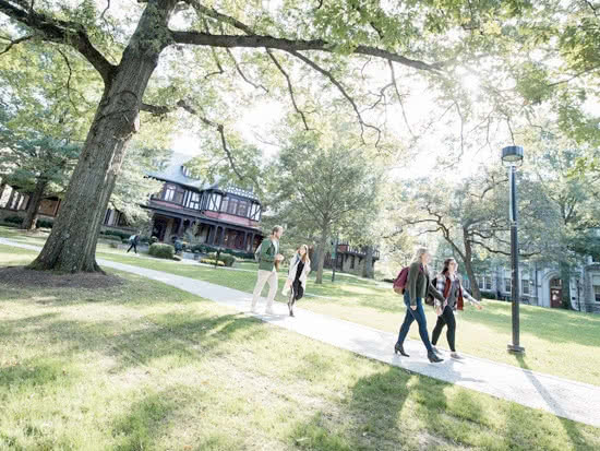 Students walking along a path on campus