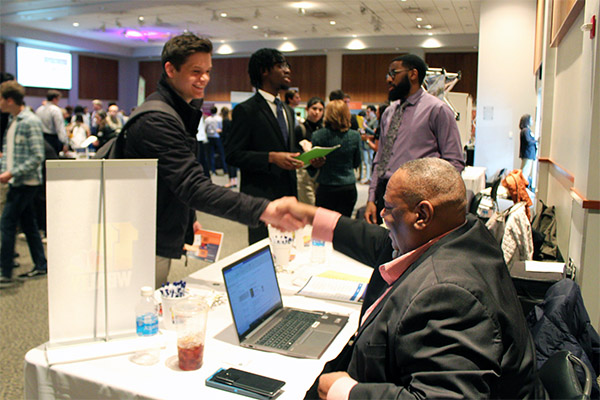 Students meet recruiters during a career fair