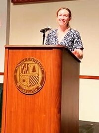 Theresa DiDonato, Ph.D., speaking at the Undergraduate Student Research and Scholarship Colloqium