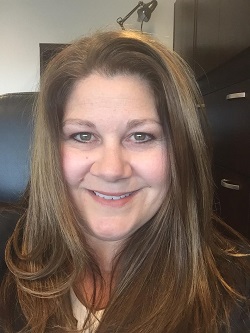 a lady with a long hair and smiling