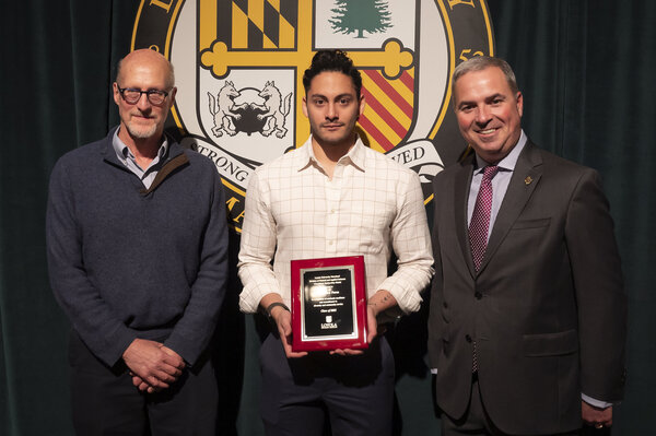 Perez receiving an award