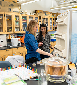 Maren Blohm, Ph.D., assistant professor of biology with student