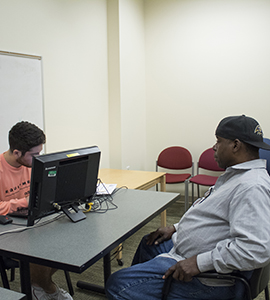 2019 Free tax clinic with Loyola student helping a client