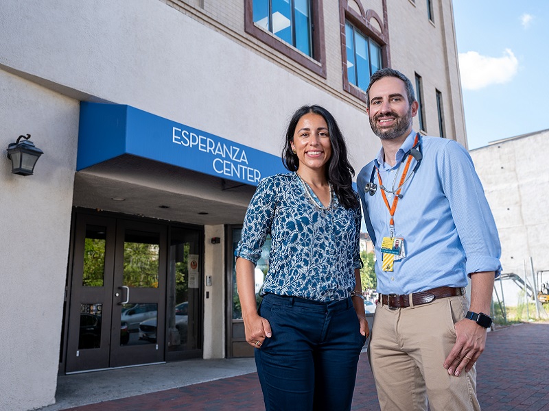 Noaf Bazaz and Nicholas Cuneo stand outside the Esperanza Center in Baltimore